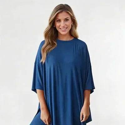 Woman in loose blue dress smiling, ZA-Zola trendy fashion apparel, white background