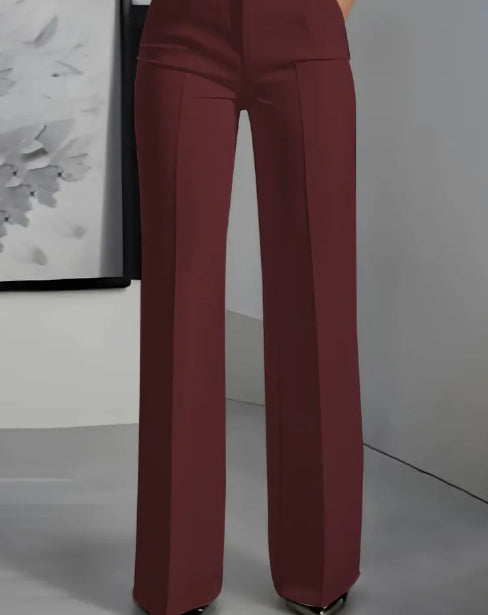 Maroon pants worn by a person against a neutral background