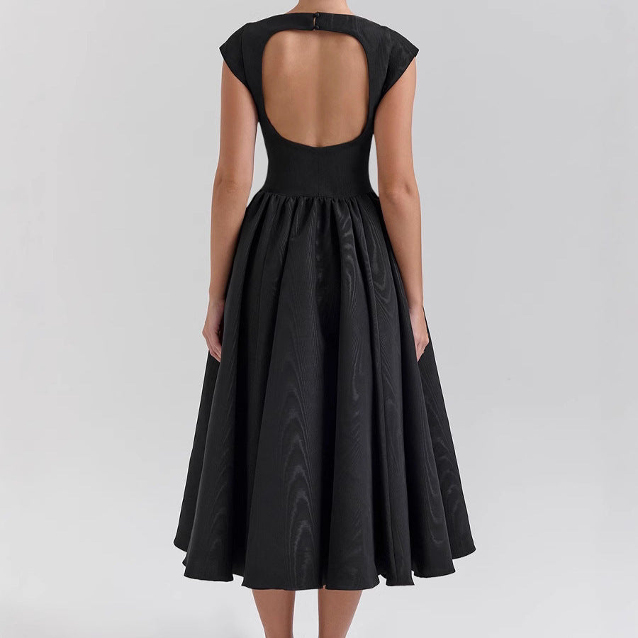 Black dress with open back on a white background