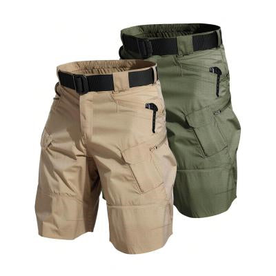 Two pairs of tactical shorts, one beige and one green, on a white background.
