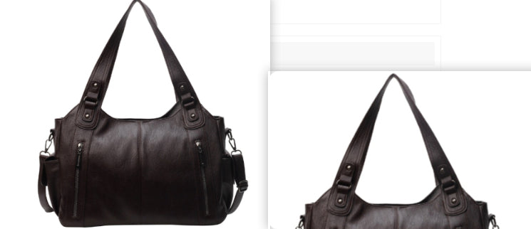 Black handbag with multiple straps and zippers on a white background