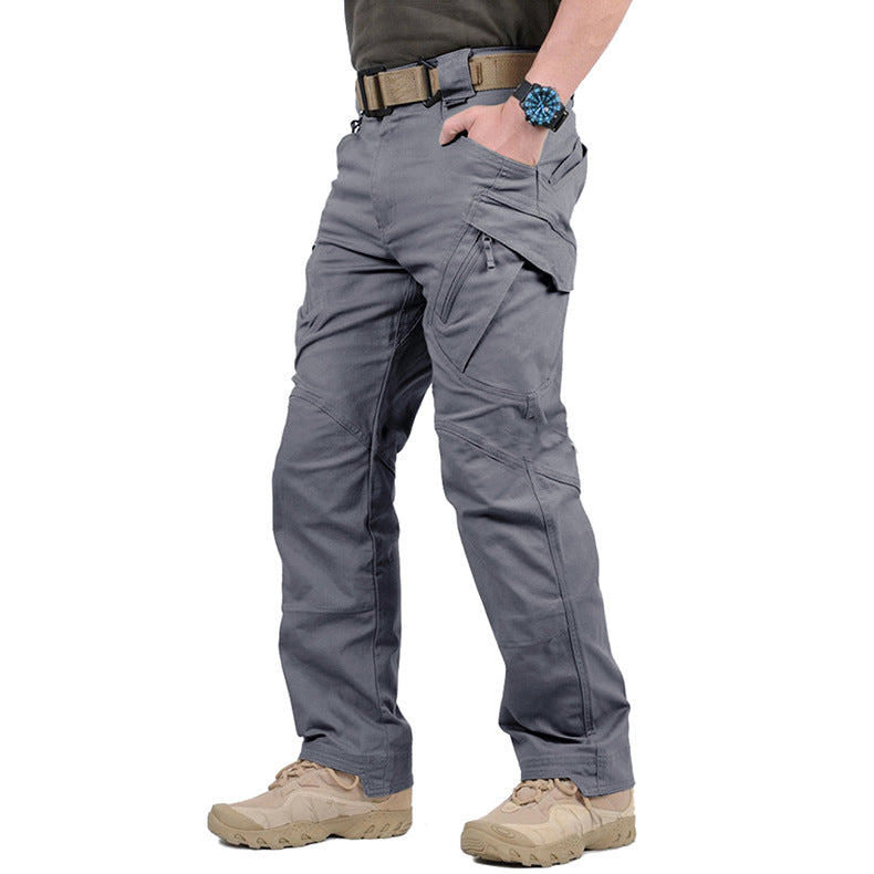 Gray tactical pants worn by a person on a white background