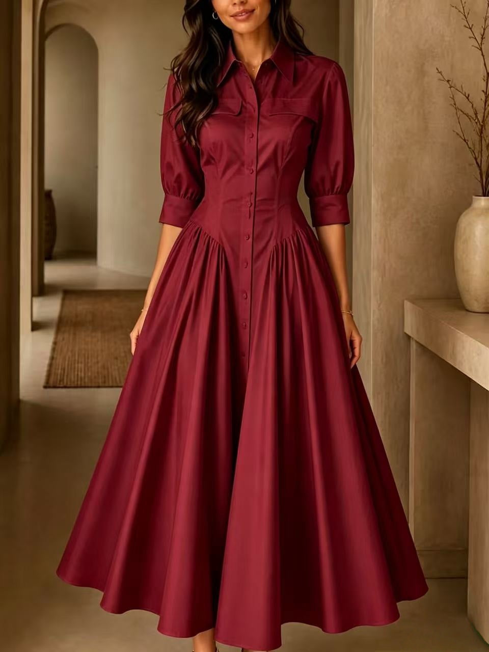 Woman wearing a burgundy dress in an indoor setting