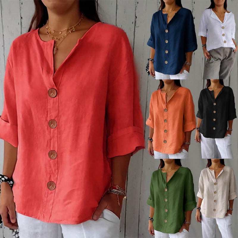 Collection of women wearing button-up shirts in various colors against a wooden panel background.
