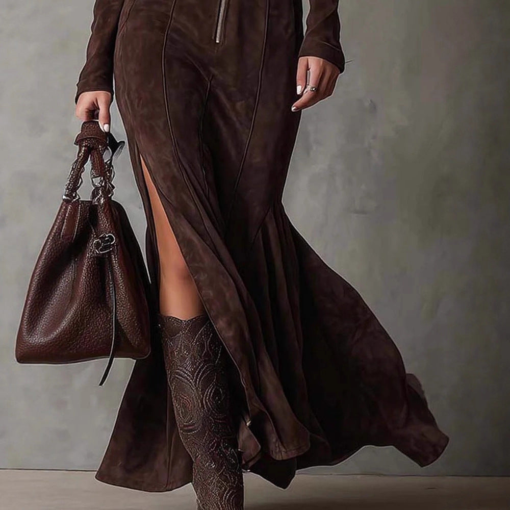Person wearing a brown dress and holding a matching brown handbag against a neutral background