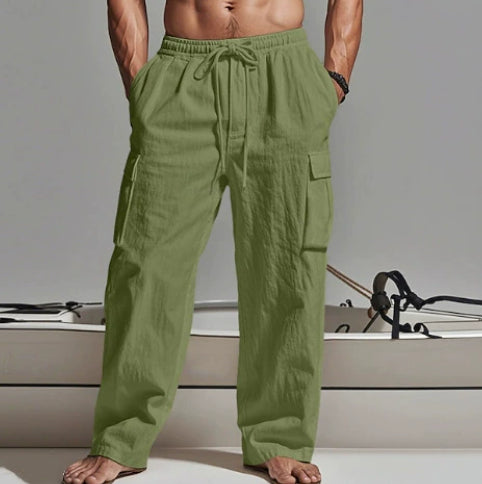 Person wearing green pants with a neutral background