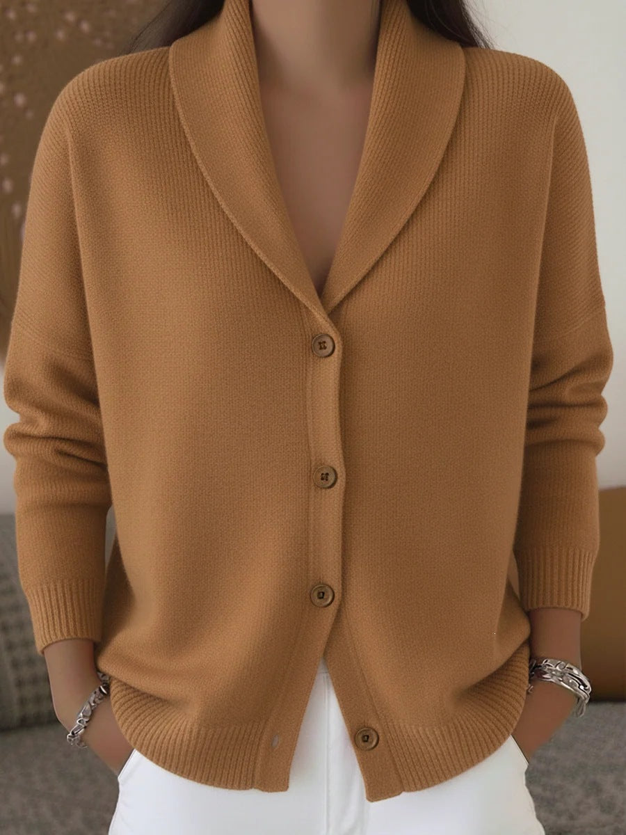 Brown cardigan worn by a person with a neutral background