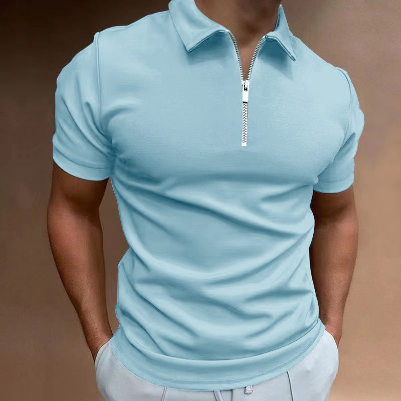 Light blue polo shirt with a zipper on a person against a brown background