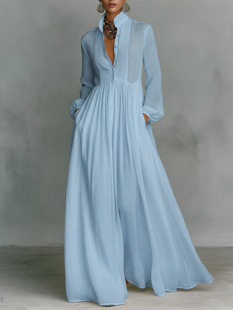 Light blue dress with long sleeves on a gray background