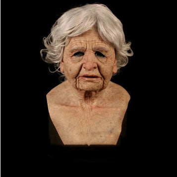 A realistic latex or silicone elderly woman bust with short white hair, dark eyes, and detailed skin texture, shown against a solid black background.