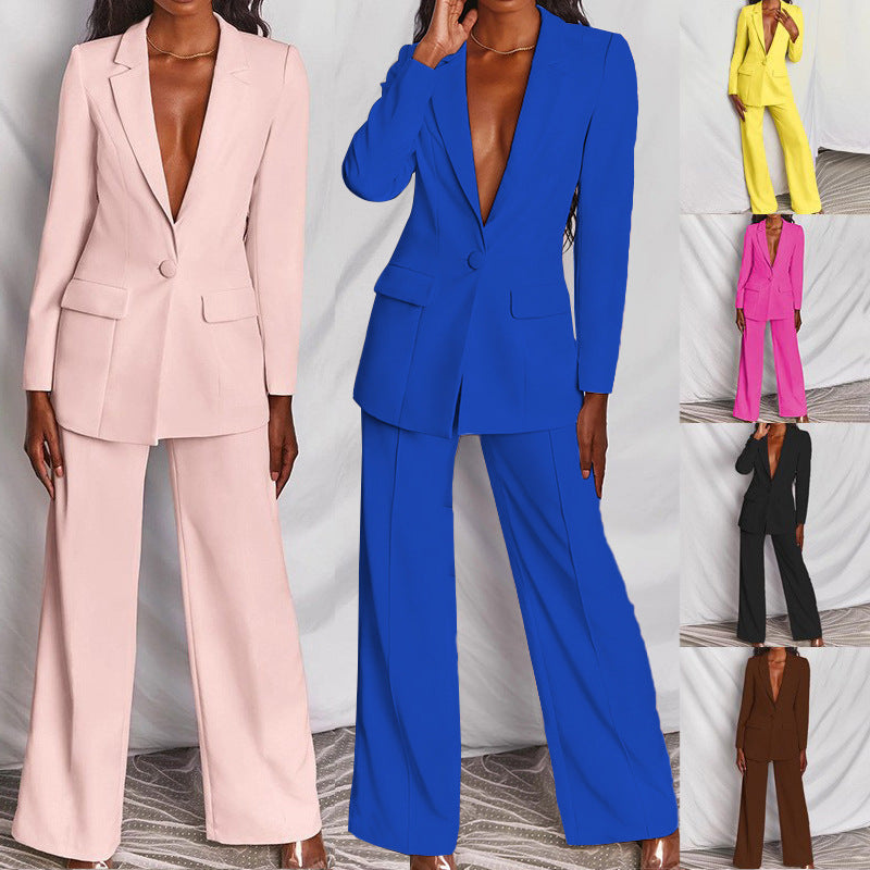 Two women wearing different colored suits on a white background
