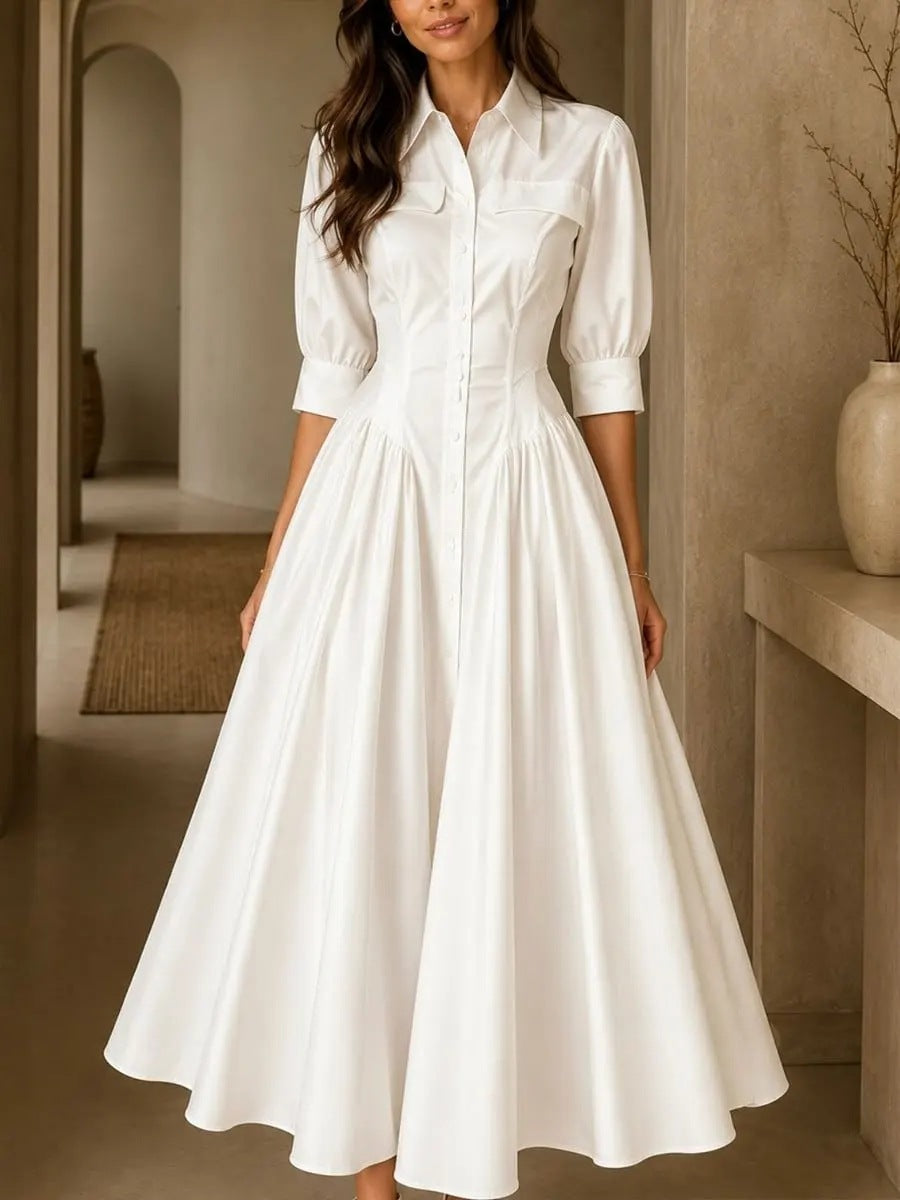 Woman wearing a white dress in an indoor setting