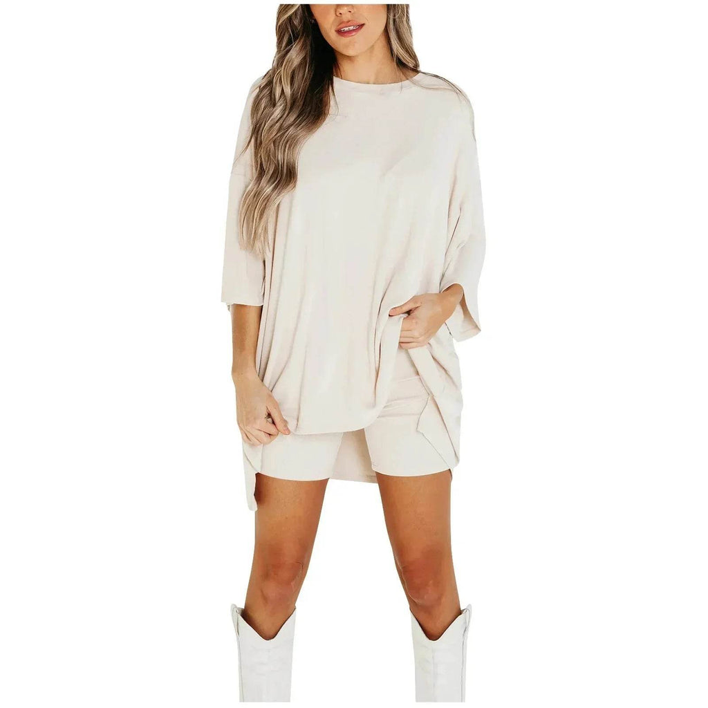 Woman wearing oversized beige top and shorts set with white boots, trendy ZA-Zola fashion