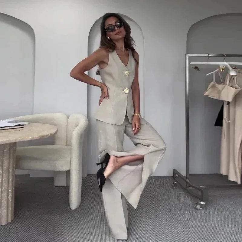 Woman in beige tailored vest and wide-leg pants, chic ZA-Zola fashion in modern setting
