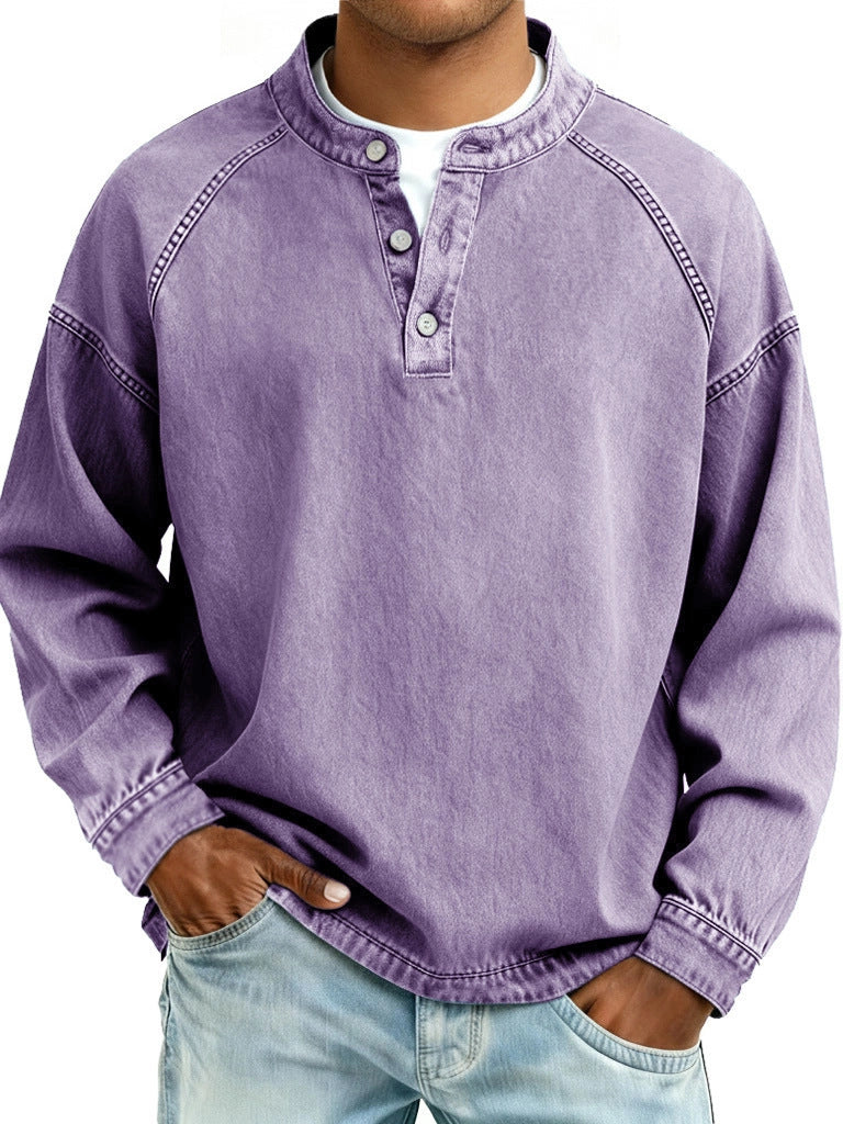 Person wearing a purple long-sleeve shirt with button details on a white background