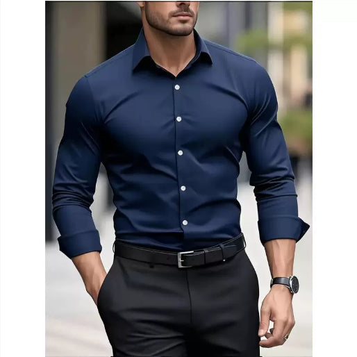 Man wearing a navy blue dress shirt with white buttons and black pants.