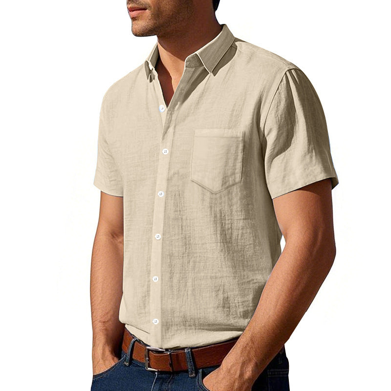 Man wearing a beige short-sleeve shirt on a white background