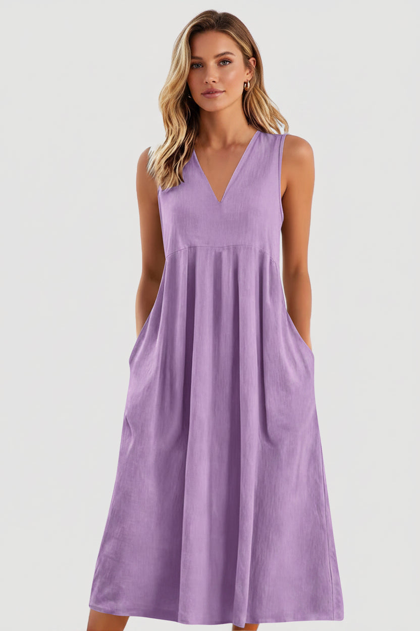 Purple sleeveless dress worn by a person on a white background