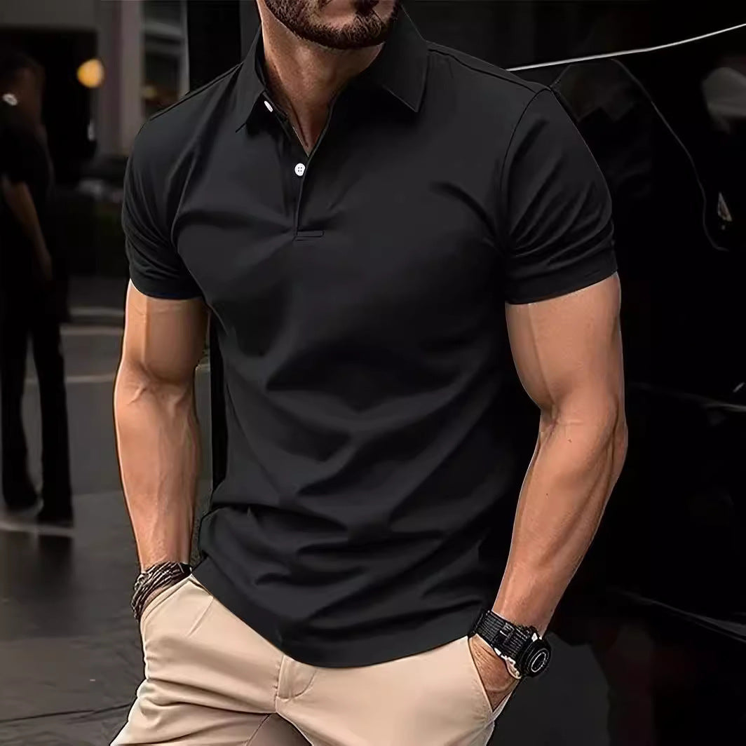 Man wearing a black polo shirt and beige pants in an urban setting