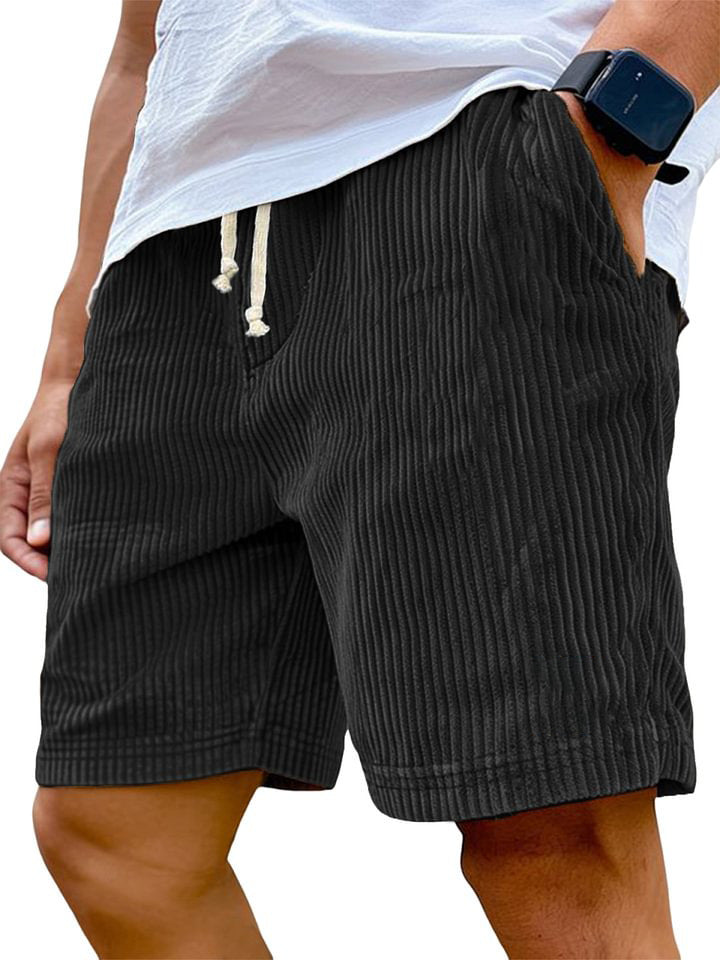 Black striped shorts worn by a person on a white background