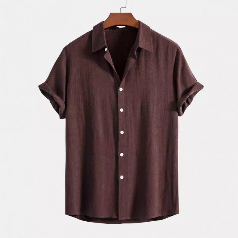 Brown short-sleeve shirt on a hanger against a white background
