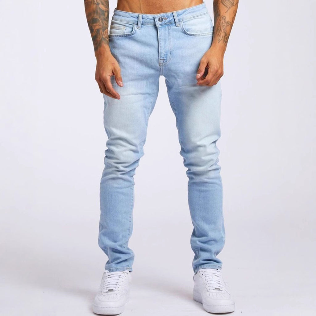 Light blue jeans worn by a person on a white background