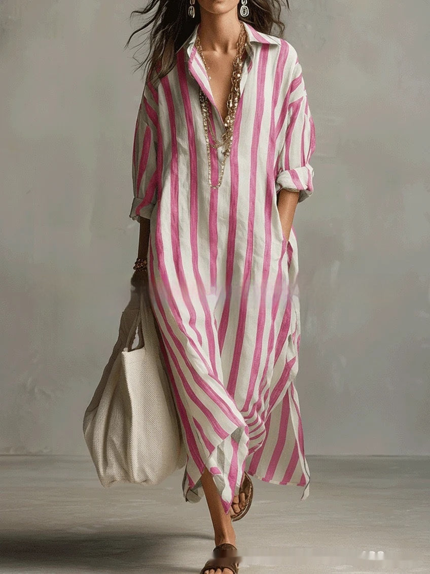 Woman wearing a pink and white striped dress with a plain background