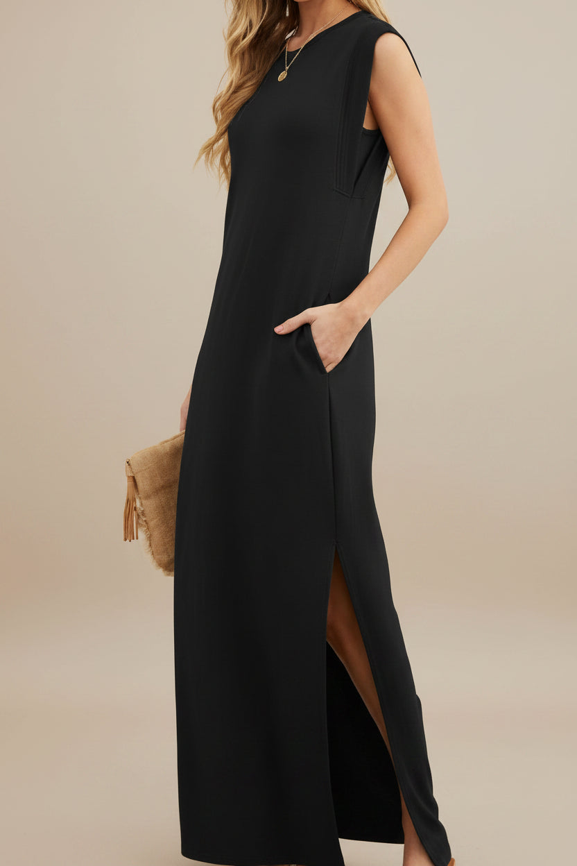 Black sleeveless dress worn by a model on a white background