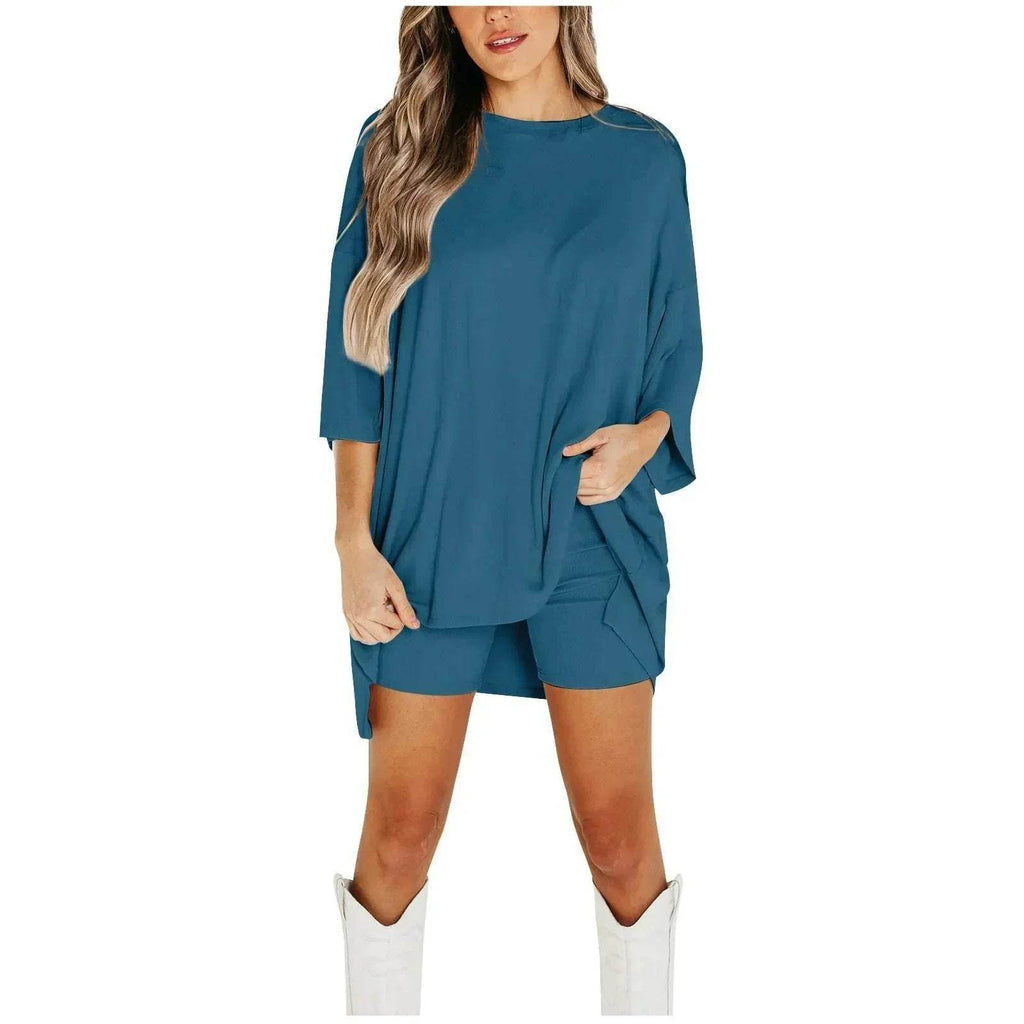 Woman in teal oversized top and shorts set with white boots, ZA-Zola trendy fashion