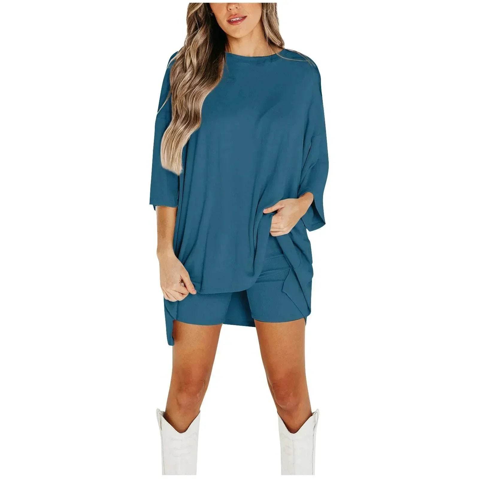 Woman in teal oversized top and shorts set with white boots, ZA-Zola trendy fashion