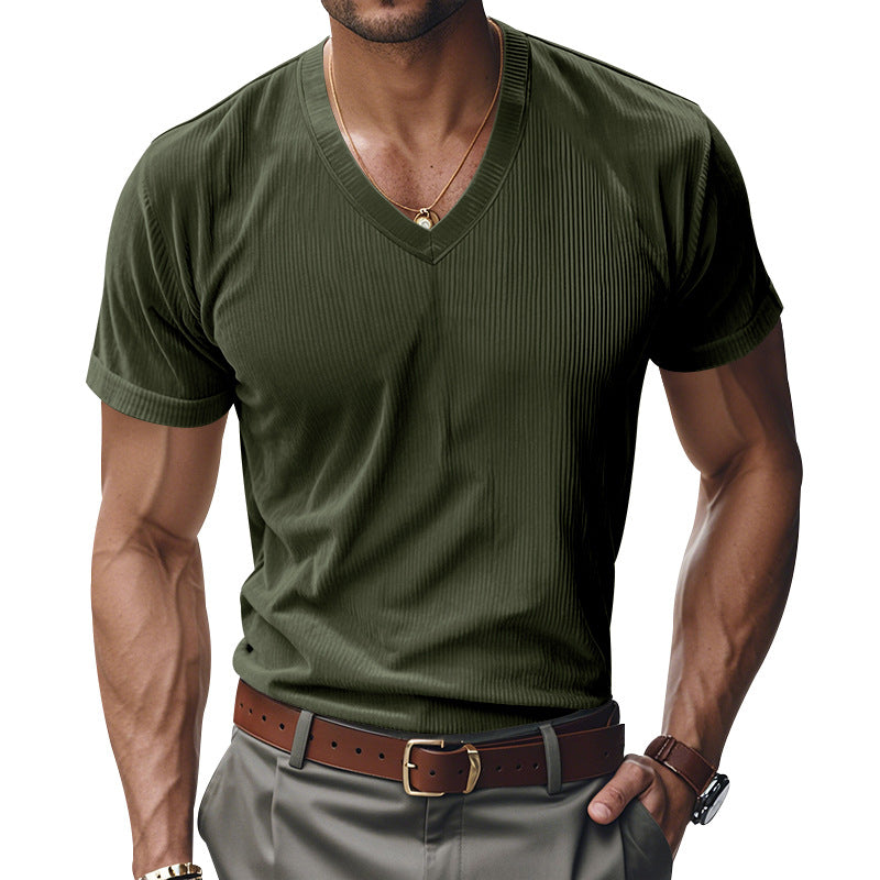 Man wearing a green ribbed V-neck t-shirt with a white background