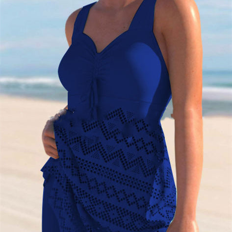 Woman wearing a blue dress with a beach background