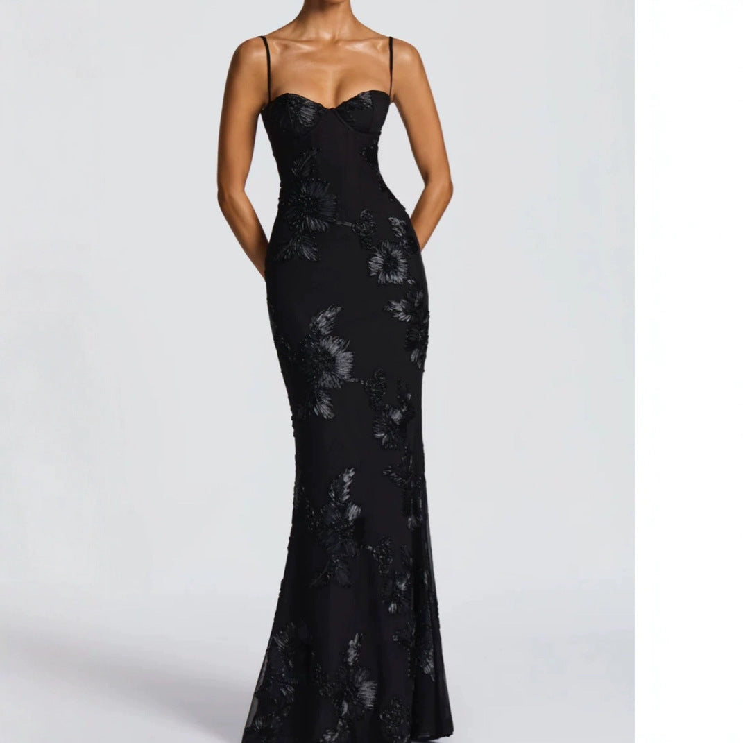 Black lace evening gown on a white background