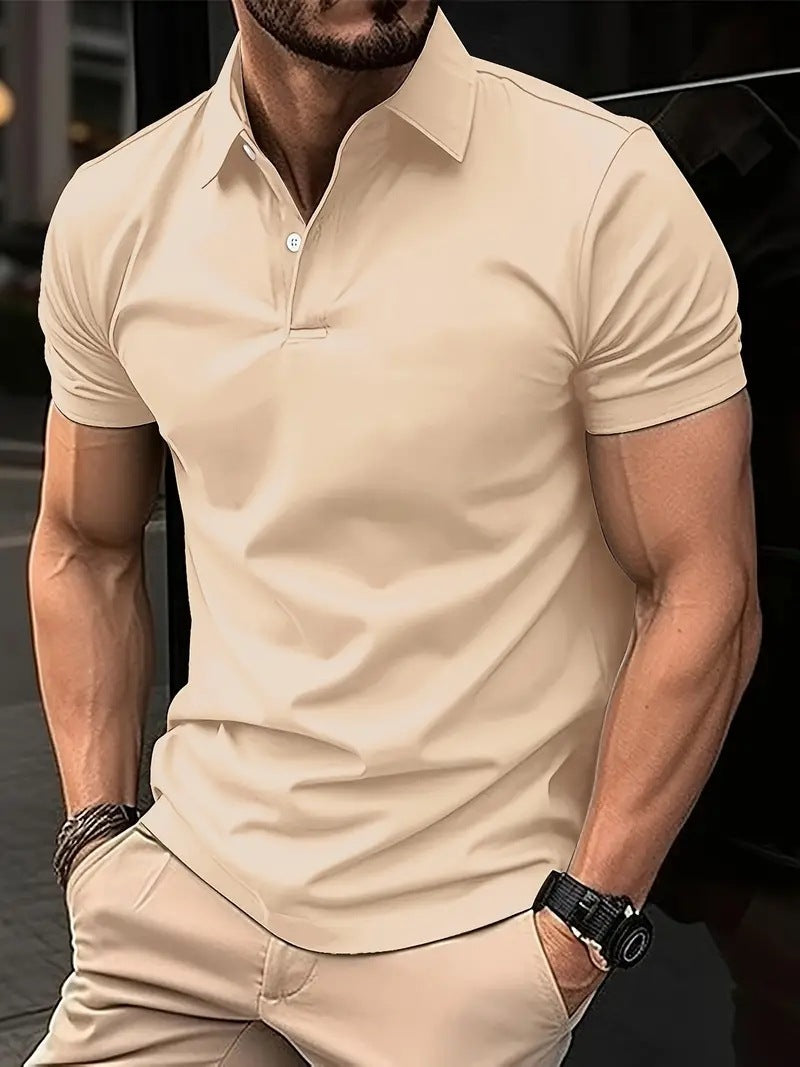 Man wearing a beige polo shirt and pants with a blurred background