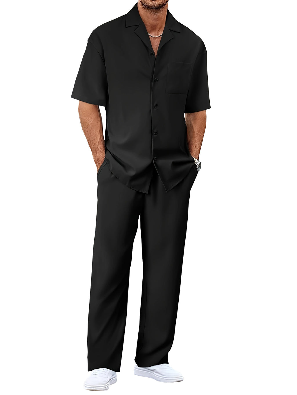 Man wearing a black shirt and pants on a white background