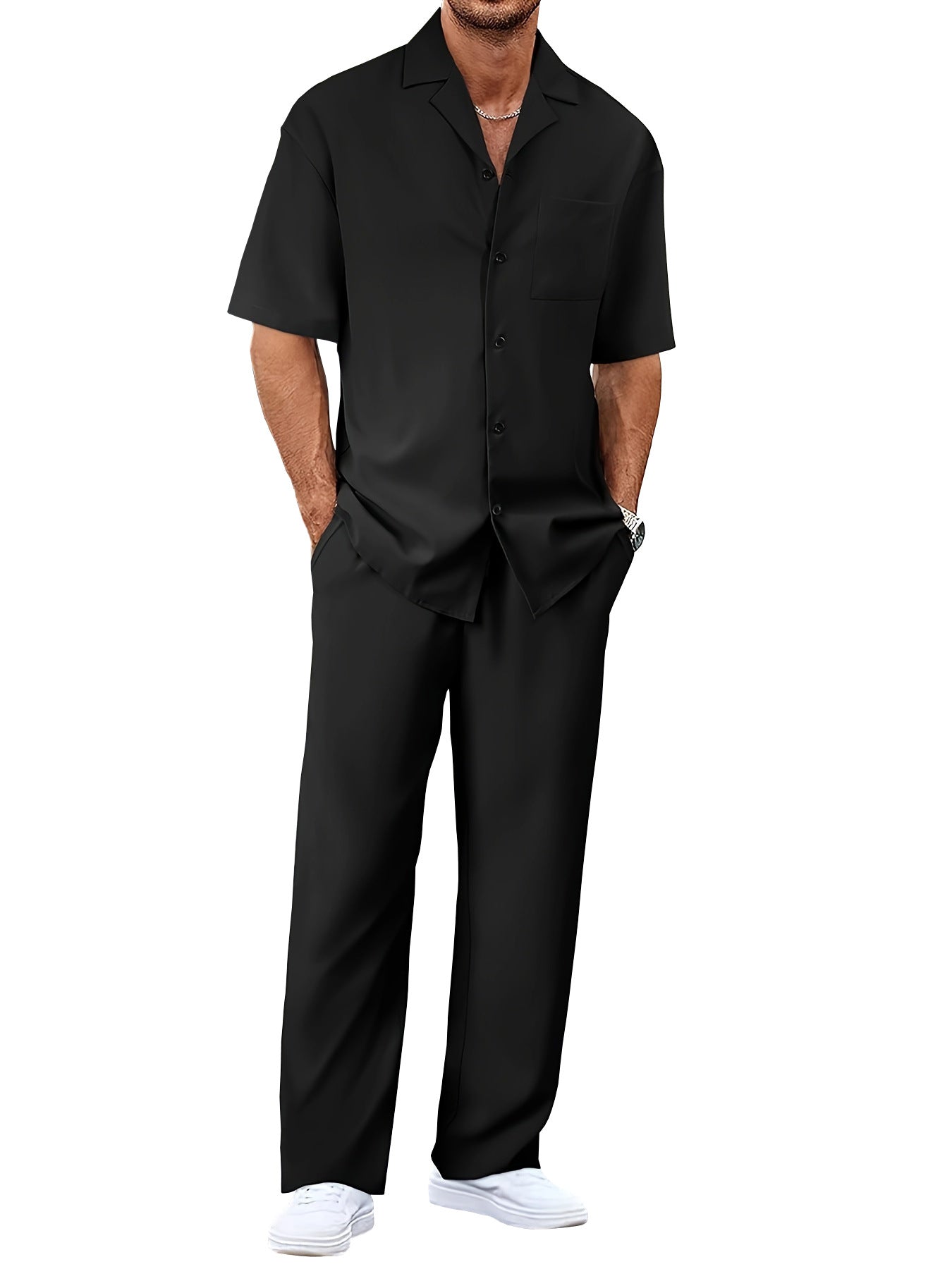 Man wearing a black shirt and pants on a white background