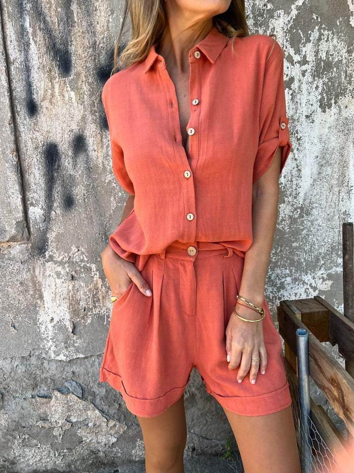 Woman wearing trendy coral button-up shirt and shorts set, ZA-Zola chic summer fashion