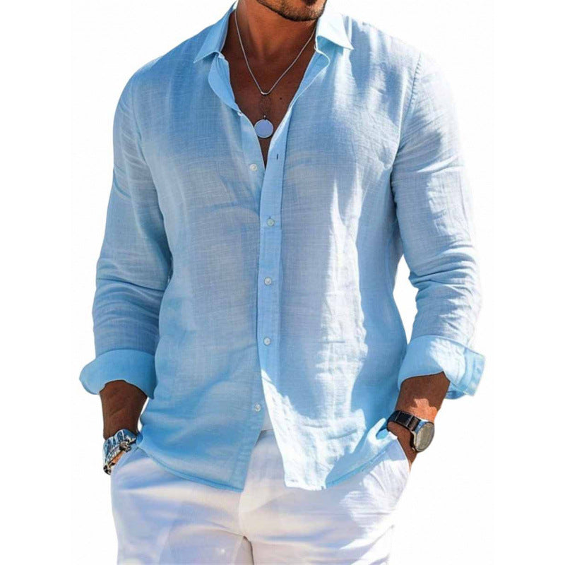 Man wearing a light blue button-up shirt and white pants on a white background