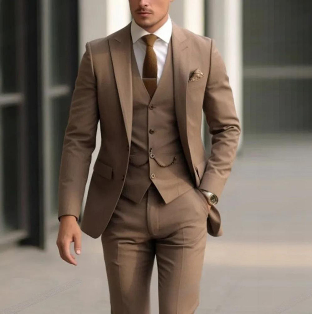 Man wearing a brown suit with a tie in an urban setting