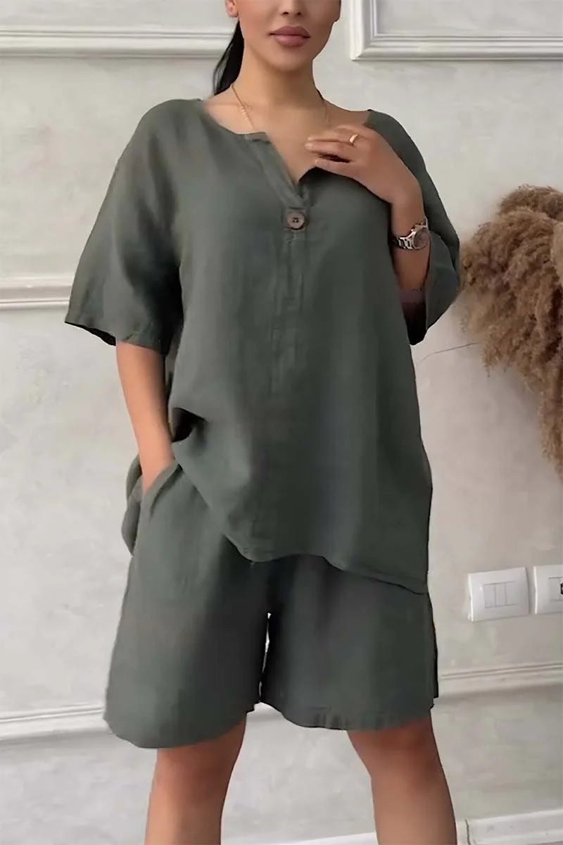 Person wearing a green outfit with a plain background