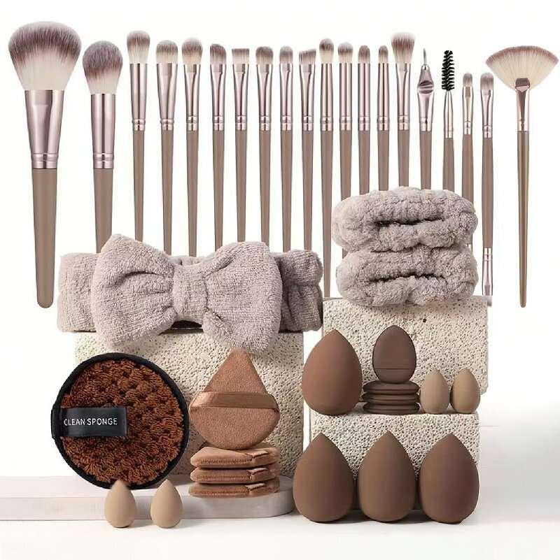 Makeup brush set with blending sponges, fluffy headband, and beauty accessories on display.