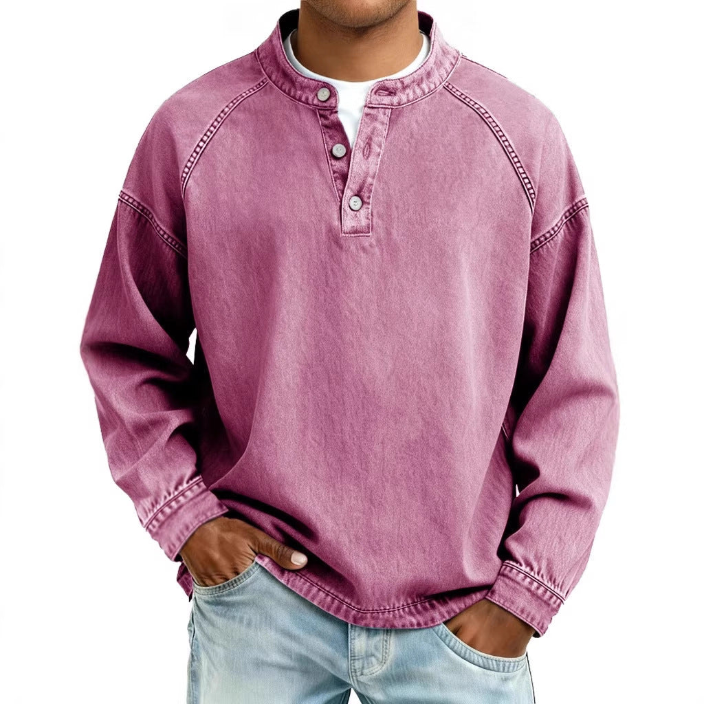 Person wearing a pink long-sleeve shirt with a white background