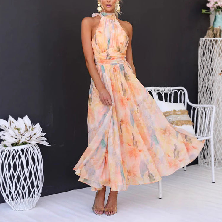 Woman wearing a floral dress in a studio setting with decorative elements.