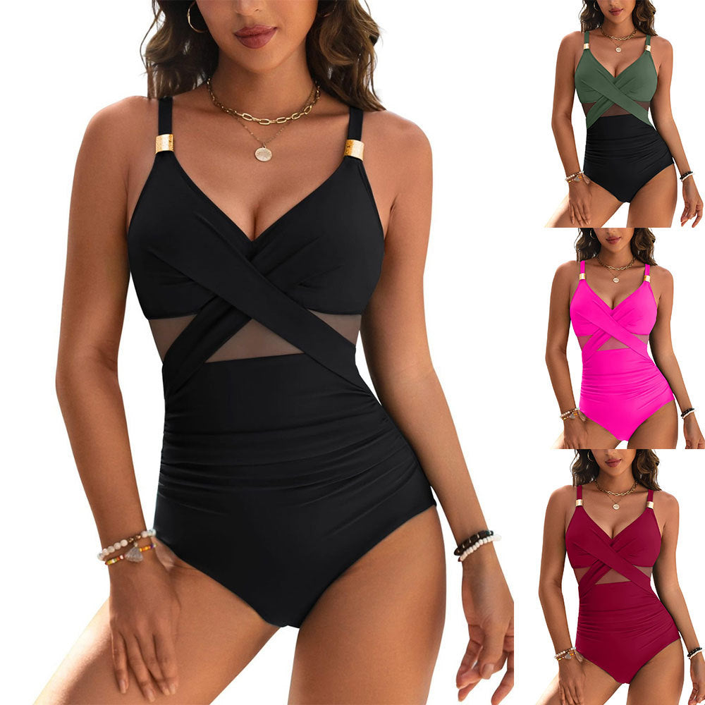 Black swimsuit with mesh panels worn by a model, displayed against a white background.
