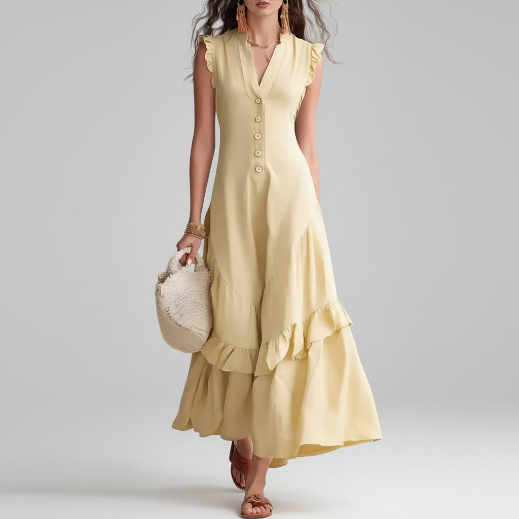 Woman wearing a yellow dress with ruffled details on a white background