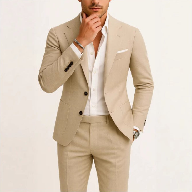 Man wearing a beige suit with a white shirt on a light background