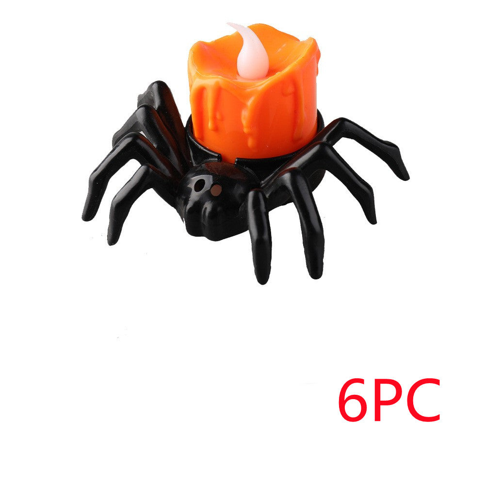 Spider-shaped candle holder with orange candle on a white background, labeled '6PC'.