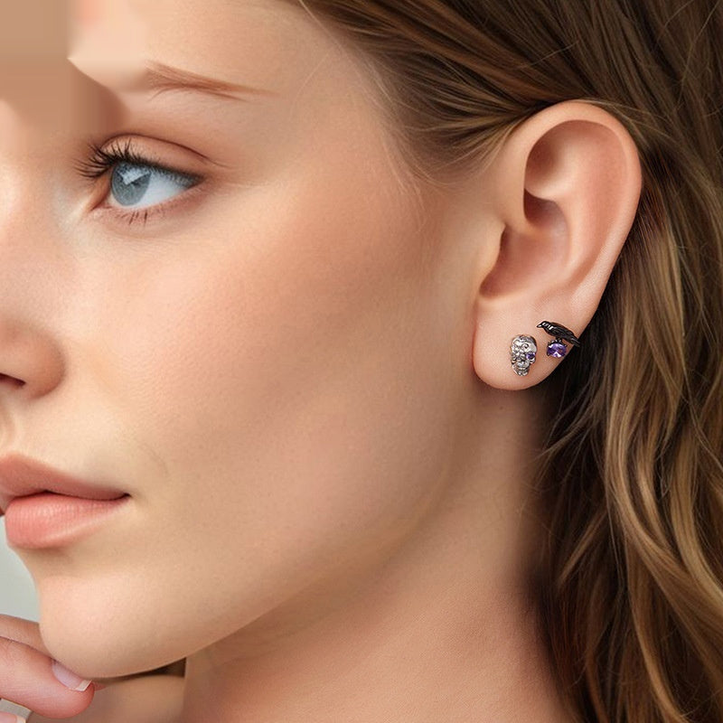 Close-up of a woman wearing earrings with a neutral background