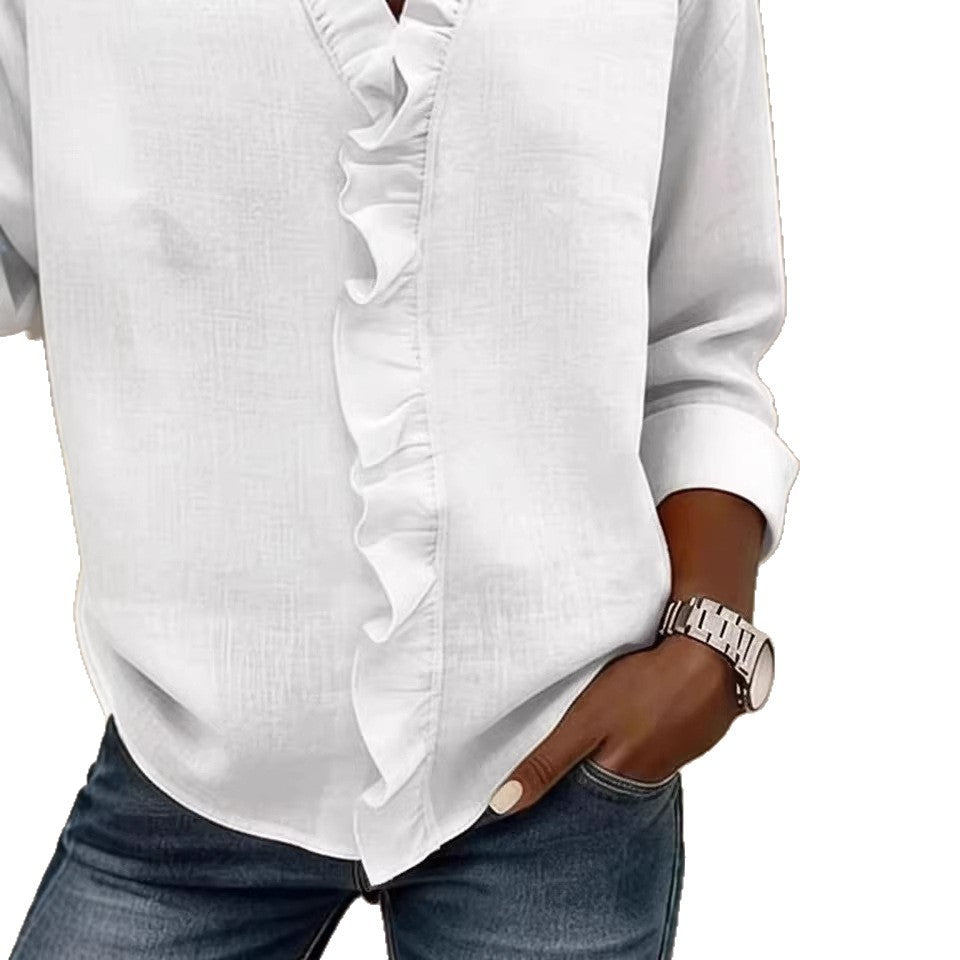 White blouse with ruffled details worn by a person on a white background