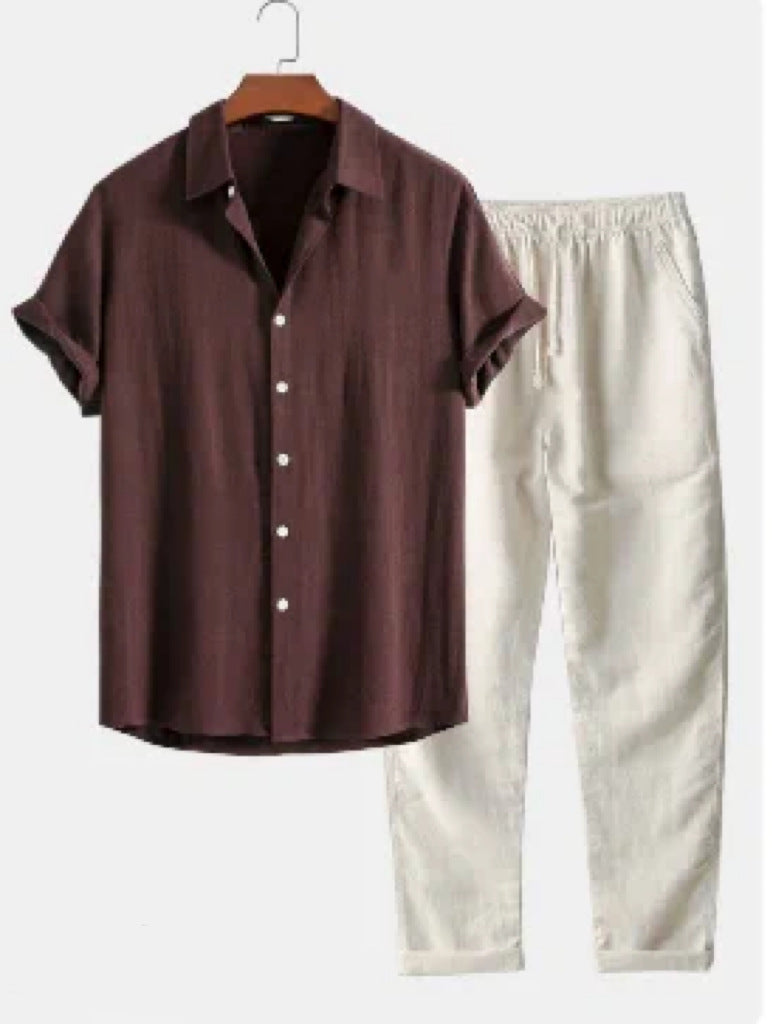 Brown shirt and white pants on a hanger against a white background